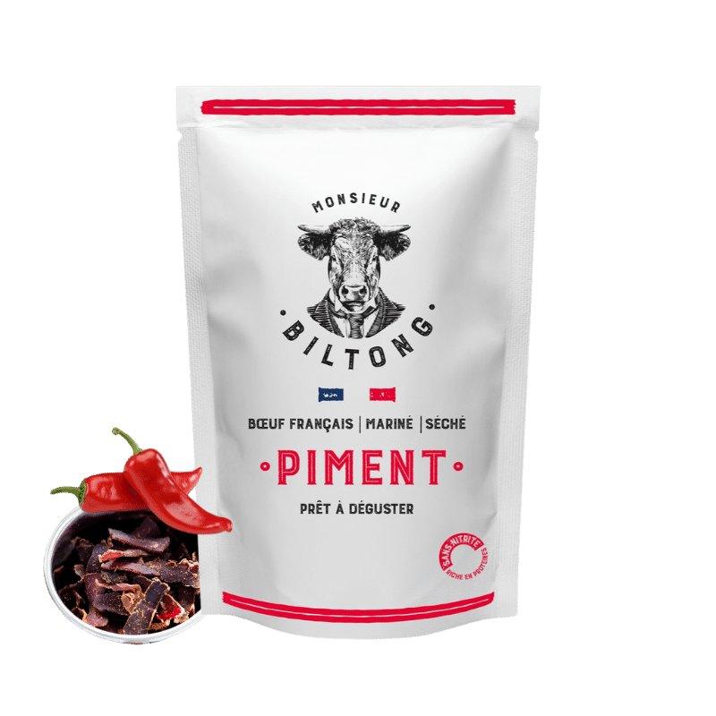 Monsieur Biltong : Biltong au piment prêt à déguster. Produit à partir de viande de boeuf français, mariné et délicatement séché dans l'atelier de Lomme (Hauts-de-France). Recette originaire d'Afrique du Sud mais made in France